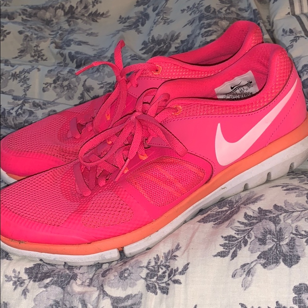 Hot pink nike athletic shoes